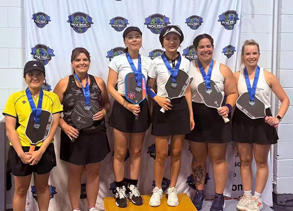 Pickleball paddles and orange balls